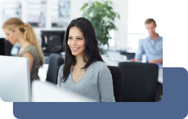 A professional woman is sitting at her computer, leveraging AI for content creation.