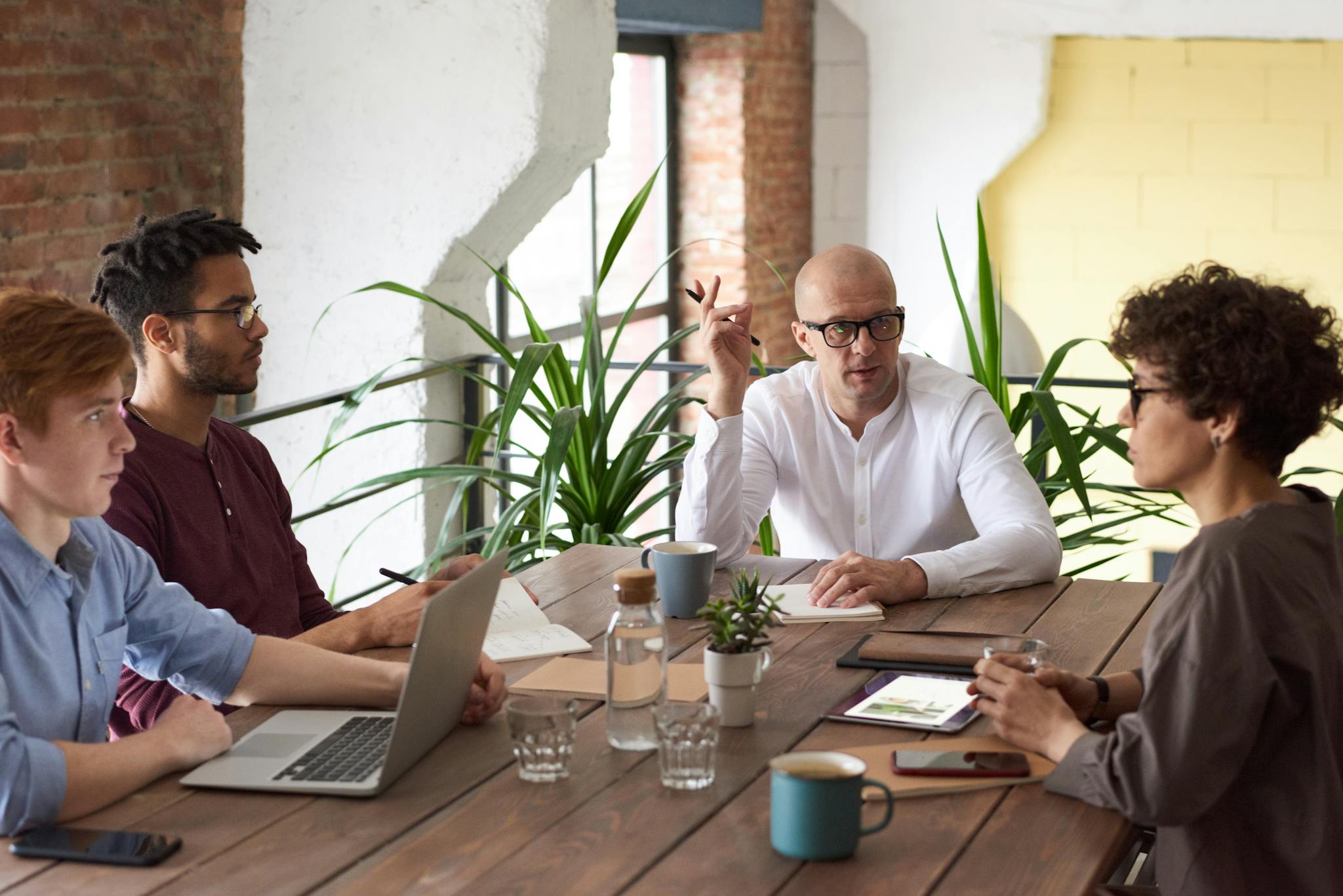 Professional content marketers meeting in an office setting.